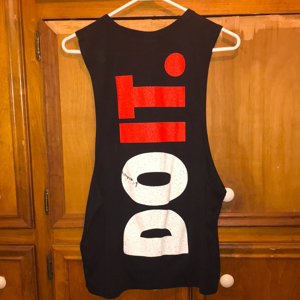 Nike muscle tank size XS but will fit up to size medium